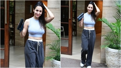 While the cropped blouse in a light blue shade features a sleeveless design, a round raised neckline, a short hem exposing her midriff, and a fitted silhouette hugging her torso, the dark grey pants have a drawstring, low waistline, a straight-leg fitting, and baggy silhouette. (HT Photo/Varinder Chawla) While the cropped blouse in a light blue shade features a sleeveless design, a round raised neckline, a short hem exposing her midriff, and a fitted silhouette hugging her torso, the dark grey pants have a drawstring, low waistline, a straight-leg fitting, and baggy silhouette. (HT Photo/Varinder Chawla)