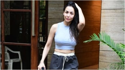 Malaika paired the chic-casual outfit with white chunky sneakers. Lastly, she let her long wet locks open, and for the glam picks she opted for a no-makeup look including on-fleek feathered brows, glossy nude lip shade, and dewy blushed skin. (HT Photo/Varinder Chawla) Malaika paired the chic-casual outfit with white chunky sneakers. Lastly, she let her long wet locks open, and for the glam picks she opted for a no-makeup look including on-fleek feathered brows, glossy nude lip shade, and dewy blushed skin. (HT Photo/Varinder Chawla)