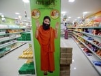A hoarding with an image of Baba Ramdev is seen inside a Patanjali store. (REUTERS)