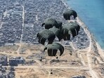 Food supplies are airdropped by the UK Armed Forces to civilians, amid the ongoing conflict between Israel and Hamas, in the northern Gaza Strip 