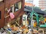 Rescue workers search for survivors at the damaged Uranus Building in Hualien, after a major earthquake hit Taiwan's east. Rescue workers search for survivors at the damaged Uranus Building in Hualien, after a major earthquake hit Taiwan's east.