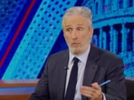 Lina Khan in conversation with Jon Stewart. (PC/YouTube/The Daily Show).