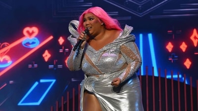 US singer Lizzo, who built her brand on being a poster girl for self-love but has been hit by employee harassment suits, said she is quitting, tired of being targeted for her looks and character.(Photo by ANGELA WEISS / AFP) (AFP) US singer Lizzo, who built her brand on being a poster girl for self-love but has been hit by employee harassment suits, said she is quitting, tired of being targeted for her looks and character.(Photo by ANGELA WEISS / AFP) (AFP)