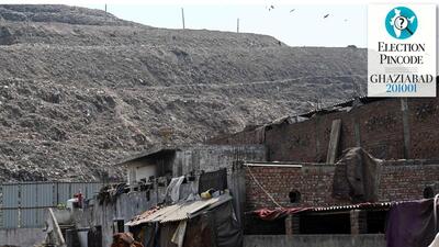 Homes and dairy units dot the foot of the Ghazipur landfill, on the fringe of the Delhi-Ghaziabad border. (Sanjeev Verma/HT Photo) Homes and dairy units dot the foot of the Ghazipur landfill, on the fringe of the Delhi-Ghaziabad border. (Sanjeev Verma/HT Photo)