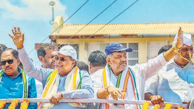 Karnataka CM Siddaramaiah and Deputy CM D.K. Shivakumar during a road show in support of Congress candidate Sunil Bose ahead of Lok Sabha elections, on Wednesday. (PTI) Karnataka CM Siddaramaiah and Deputy CM D.K. Shivakumar during a road show in support of Congress candidate Sunil Bose ahead of Lok Sabha elections, on Wednesday. (PTI)