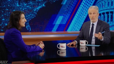 Lina Khan in conversation with Jon Stewart. (PC/YouTube/The Daily Show). Lina Khan in conversation with Jon Stewart. (PC/YouTube/The Daily Show).