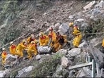 Firefighters evacuate a body from the Taroko National Park a day after a powerful earthquake struck, in the Hualien county, eastern Taiwan.