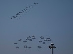 An aircraft airdrops humanitarian aid over northern Gaza Strip as seen from southern Israel, Thursday, April 4, 2024. AP/PTI(AP04_04_2024_000298A) An aircraft airdrops humanitarian aid over northern Gaza Strip as seen from southern Israel, Thursday, April 4, 2024. AP/PTI(AP04_04_2024_000298A)