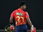 Punjab Kings' Shashank Singh celebrates their win against Gujarat Titans at the Indian Premier League (IPL) Twenty20 cricket match in the Narendra Modi Stadium