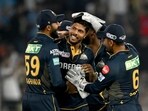 Gujarat Titans' Umesh Yadav (C) celebrates with teammates after taking the wicket of Punjab Kings' captain Shikhar Dhawan Gujarat Titans' Umesh Yadav (C) celebrates with teammates after taking the wicket of Punjab Kings' captain Shikhar Dhawan