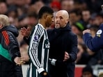 Manchester United manager Erik ten Hag speaks with Marcus Rashford after he was substituted 