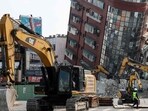 Taiwan Earthquake: Bulldozers being used to remove debris near a damaged building in Hualien, after a major earthquake hit Taiwan's east. Taiwan Earthquake: Bulldozers being used to remove debris near a damaged building in Hualien, after a major earthquake hit Taiwan's east.