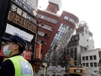 A police officer stands guard near a partially collapsed building a day after a powerful earthquake struck in Hualien City, eastern Taiwan, Thursday, April 4, 2024. (AP Photo/Chiang Ying-ying) A police officer stands guard near a partially collapsed building a day after a powerful earthquake struck in Hualien City, eastern Taiwan, Thursday, April 4, 2024. (AP Photo/Chiang Ying-ying)