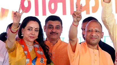 Uttar Pradesh Chief Minister Yogi Adityanath with BJP candidate Hema Malini during a public meeting after Malini filed her nomination papers, in Mathura, UP. (PTI) Uttar Pradesh Chief Minister Yogi Adityanath with BJP candidate Hema Malini during a public meeting after Malini filed her nomination papers, in Mathura, UP. (PTI)
