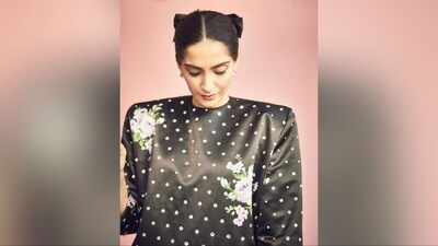 With the help of hairstylist Namrata Soni, Sonam styled her luscious locks into a middle-parted, neat bun and adorned it with a trendy black bow, adding a chic vibe and the perfect finishing touch to her look.&nbsp; (Instagram/@sonamkapoor)