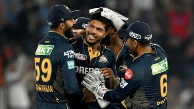 Gujarat Titans' Umesh Yadav (C) celebrates with teammates after taking the wicket of Punjab Kings' captain Shikhar Dhawan (AFP) Gujarat Titans' Umesh Yadav (C) celebrates with teammates after taking the wicket of Punjab Kings' captain Shikhar Dhawan (AFP)