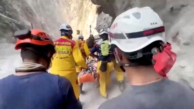 In this screengrab taken from a video, rescuers can be seen taking a person on a stretcher, following the earthquake, in Hualien, Taiwan. (REUTERS)