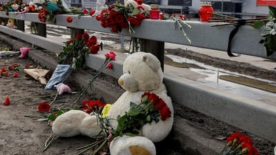 FILE PHOTO: Flowers and toys are placed on the roadside in front of the burnt-out Crocus City Hall following a deadly attack on the concert venue on the outskirts of Moscow, Russia, March 26, 2024. REUTERS/Evgenia Novozhenina/File Photo (REUTERS)