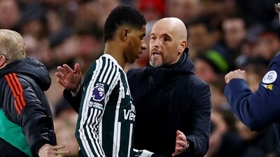 Manchester United manager Erik ten Hag speaks with Marcus Rashford after he was substituted (Reuters)