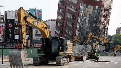 Taiwan Earthquake: Bulldozers being used to remove debris near a damaged building in Hualien, after a major earthquake hit Taiwan's east. (AFP) Taiwan Earthquake: Bulldozers being used to remove debris near a damaged building in Hualien, after a major earthquake hit Taiwan's east. (AFP)