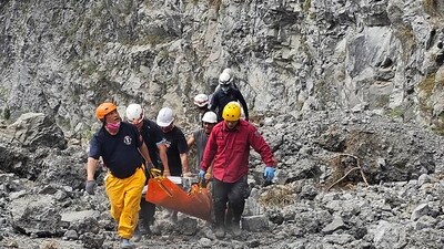 Rescue workers used ropes to navigate the uneven terrain filled with jagged rocks, as shown in footage released by officials. (AP) Rescue workers used ropes to navigate the uneven terrain filled with jagged rocks, as shown in footage released by officials. (AP)