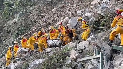 Rescuers are searching for missing individuals and striving to reach hundreds who are stranded after Taiwan experienced its strongest earthquake in 25 years. The quake caused boulders and mud to tumble down mountainsides, blocking roads. The disaster has claimed the lives of ten people and left over 1,000 injured. (AP) Rescuers are searching for missing individuals and striving to reach hundreds who are stranded after Taiwan experienced its strongest earthquake in 25 years. The quake caused boulders and mud to tumble down mountainsides, blocking roads. The disaster has claimed the lives of ten people and left over 1,000 injured. (AP)