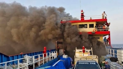 Smoke rises from a ferry in Surat Thani province, Thailand. (AP) Smoke rises from a ferry in Surat Thani province, Thailand. (AP)