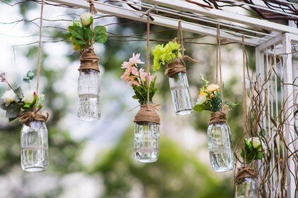Plants in bulbs add a fresh, green vibe to the outdoor setting (Shutterstock)