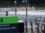 Flood water is seen flowing through the Parramatta wharf in Sydney on April 5, 2024, after heavy rain lashed eastern Australia, causing flash flooding and a string of emergency warnings up and down the Pacific coast. 