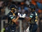 Gujarat Titans' captain Shubman Gill (L) and Sai Sudharsan bump their fists. Gujarat Titans' captain Shubman Gill (L) and Sai Sudharsan bump their fists.