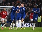 Chelsea's Cole Palmer celebrates scoring their fourth goal with Benoit Badiashile and Alfie Gilchrist.