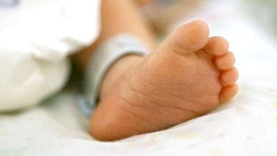 The woman, after being denied admission to the hospital, experienced severe labour pain and was forced to give birth to the child near the hospital gate. (HT File) The woman, after being denied admission to the hospital, experienced severe labour pain and was forced to give birth to the child near the hospital gate. (HT File)