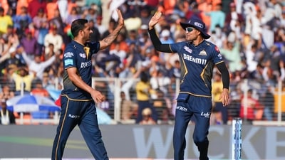 Gujarat Titans' captain Shubman Gill and Mohit Sharma celebrate a wicket. (ANI) Gujarat Titans' captain Shubman Gill and Mohit Sharma celebrate a wicket. (ANI)