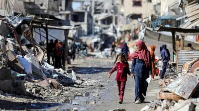 FILE PHOTO: Palestinians walk past the ruins of houses destroyed during Israel's military offensive, amid the ongoing conflict between Israel and Hamas, in Gaza City. (REUTERS) FILE PHOTO: Palestinians walk past the ruins of houses destroyed during Israel's military offensive, amid the ongoing conflict between Israel and Hamas, in Gaza City. (REUTERS)