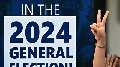 A participant gestures next to an election sign board during the Vote-A-Thon, an awareness campaign organized by the Karnataka's Chief Electoral Office to encourage 100 percent voting turnout for the upcoming 2024 general elections, in Bengaluru on March 17, 2024. India's election commission announced on March 16 that national polls would begin on April 19, with Hindu-nationalist Prime Minister Narendra Modi strongly favoured to win a third term in the world's largest democracy. (Photo by Idrees MOHAMMED / AFP) (AFP) A participant gestures next to an election sign board during the Vote-A-Thon, an awareness campaign organized by the Karnataka's Chief Electoral Office to encourage 100 percent voting turnout for the upcoming 2024 general elections, in Bengaluru on March 17, 2024. India's election commission announced on March 16 that national polls would begin on April 19, with Hindu-nationalist Prime Minister Narendra Modi strongly favoured to win a third term in the world's largest democracy. (Photo by Idrees MOHAMMED / AFP) (AFP)