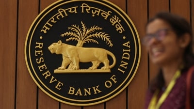 A woman walks past the Reserve Bank of India (RBI) logo inside its headquarters in Mumbai, India. (Reuters)