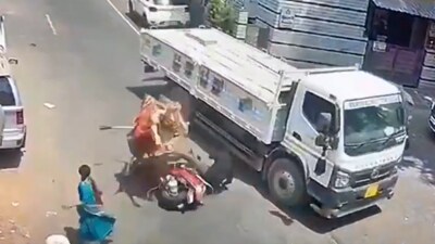 The bull continues to run erratically after knocking down the biker. The bull continues to run erratically after knocking down the biker.