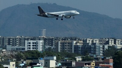 Vistara Flight Disruptions: A Vistara passenger aircraft lands at the Chhatrapati Shivaji International airport in Mumbai, India. The airline, which operates more than 300 flights daily, has cut 20-25 daily flights, Vistara CEO said. (Reuters)