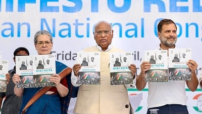 Congress President Mallikarjun Kharge with senior party leaders Sonia Gandhi and Rahul Gandhi releases the party's manifesto ahead of Lok Sabha elections, in New Delhi, Friday, April 5, 2024. (PTI)