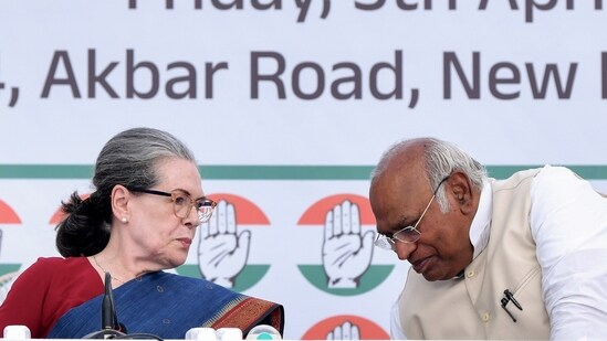 Congress President Mallikarjun Kharge in a conversation with party leader Sonia Gandhi at the launch of the party's manifesto for the 2024 Lok Sabha elections, at AICC headquarters in Delhi.