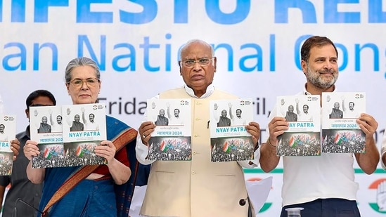 Congress President Mallikarjun Kharge with senior party leaders Sonia Gandhi and Rahul Gandhi releases the party's manifesto ahead of Lok Sabha elections, in New Delhi, Friday, April 5, 2024. (PTI)