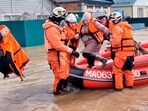 In this grab taken from a video released by the Russian Emergency Ministry Press Service on Saturday, April 6, 2024, emergency workers evacuate a local resident after a part of a dam burst causing flooding, in Orsk, Russia. Floods hit a city in the Ural Mountains areas after a river dam burst there, prompting evacuations of hundreds of people, local authorities said. 