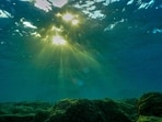(FILES) This underwater photograph shows light penetrating the water surface in the Mediterranean Sea off the coast of Batroun city on August 1, 2023. Global temperatures "smashed" heat records last year, as heatwaves stalked oceans and glaciers suffered record ice loss, the United Nations said on March 19, 2024, warning 2024 was likely to be even hotter. The annual State of the Climate report by the UN's World Meteorological Organization confirmed preliminary data showing 2023 was by far the hottest year ever recorded. (Photo by Ibrahim CHALHOUB / AFP)