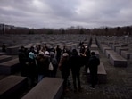 FILE - Tourists visit the Holocaust Memorial in Berlin, Germany, on International Holocaust Remembrance Day, on Jan. 27, 2024. More than 250 Holocaust survivors have joined an international initiative to share their stories of loss and survival with students around the world during a time of rising antisemitism following the Oct. 7 Hamas attack on Israel that triggered the war in the Gaza Strip. The Survivor Speakers Bureau was launched Thursday by the New York-based Conference on Jewish Material Claims Against Germany, also referred to as the Claims Conference. (AP Photo/Markus Schreiber, File)