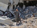 A Palestinian man looks on as he stands on the rubble in a devastated area around Gaza's Al-Shifa hospital on April 3, 2024, amid the ongoing conflict between Israel and the Palestinian Hamas militant group. A Palestinian man looks on as he stands on the rubble in a devastated area around Gaza's Al-Shifa hospital on April 3, 2024, amid the ongoing conflict between Israel and the Palestinian Hamas militant group.