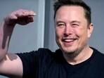 Tesla CEO Elon Musk waves as he leaves the Tesla Gigafactory for electric cars after a visit in Gruenheide near Berlin, Germany, Wednesday, March 13, 2024. ((AP Photo/Ebrahim Noroozi)