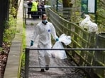Forensic officers at Kersal Dale, near Salford, where a headless human torso was found.