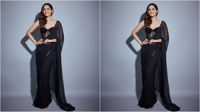 Her sizzling black saree look features an off-the-shoulder blouse with a sweetheart neckline, sheer fabric and trendy corset detailing. She elegantly wrapped her sheer saree around herself, letting the pallu fall beautifully from her shoulders. (Instagram/@manushi_chhillar) Her sizzling black saree look features an off-the-shoulder blouse with a sweetheart neckline, sheer fabric and trendy corset detailing. She elegantly wrapped her sheer saree around herself, letting the pallu fall beautifully from her shoulders. (Instagram/@manushi_chhillar)