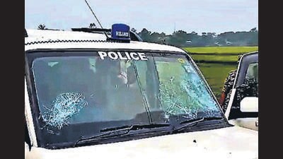 A police vehicle after it was attacked by villagers in Purba Medinipur district on Saturday. (PTI) A police vehicle after it was attacked by villagers in Purba Medinipur district on Saturday. (PTI)