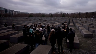FILE - Tourists visit the Holocaust Memorial in Berlin, Germany, on International Holocaust Remembrance Day, on Jan. 27, 2024. More than 250 Holocaust survivors have joined an international initiative to share their stories of loss and survival with students around the world during a time of rising antisemitism following the Oct. 7 Hamas attack on Israel that triggered the war in the Gaza Strip. The Survivor Speakers Bureau was launched Thursday by the New York-based Conference on Jewish Material Claims Against Germany, also referred to as the Claims Conference. (AP Photo/Markus Schreiber, File) (AP) FILE - Tourists visit the Holocaust Memorial in Berlin, Germany, on International Holocaust Remembrance Day, on Jan. 27, 2024. More than 250 Holocaust survivors have joined an international initiative to share their stories of loss and survival with students around the world during a time of rising antisemitism following the Oct. 7 Hamas attack on Israel that triggered the war in the Gaza Strip. The Survivor Speakers Bureau was launched Thursday by the New York-based Conference on Jewish Material Claims Against Germany, also referred to as the Claims Conference. (AP Photo/Markus Schreiber, File) (AP)
